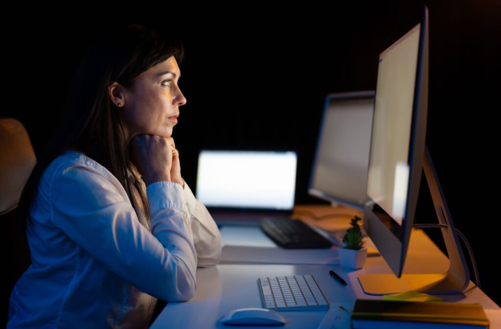 A person starting at a computer screen.